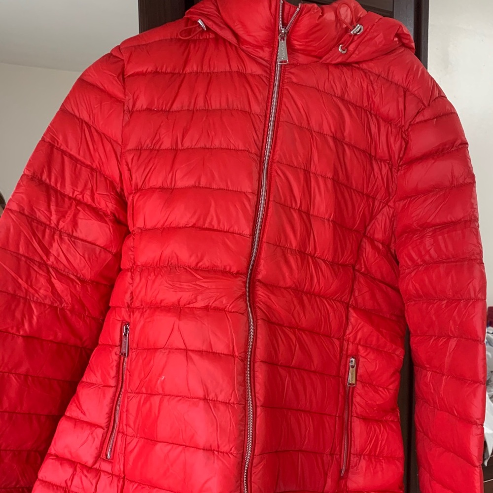 Packable down hooded coat.